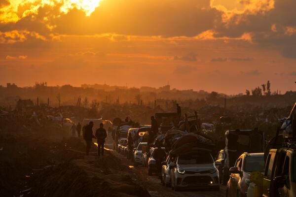 Displaced Palestinians make their way from central Gaza to their homes in the northern Gaza Strip, Monday, Feb. 10, 2025. (AP Photo/Abdel Kareem Hana)