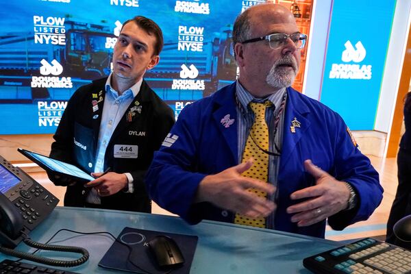 Trader Dylan Halvorsan, left, and specialist Douglas Johnson work on the floor of the New York Stock Exchange, Monday, May 12, 2025. (AP Photo/Richard Drew)