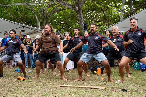 Members of Te Aurere of New Zealand performs Maori haka during Hokulea's 50th birthday commemoration at Kualoa Regional Park, Saturday, March 8, 2025, in Kaneohe, Hawaii. (AP Photo/Mengshin Lin)