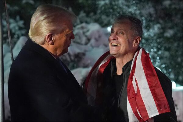 President Donald Trump greets Marc Fogel at on the South Lawn at the White House, Tuesday, Feb. 11, 2025, in Washington. (AP Photo/Evan Vucci)