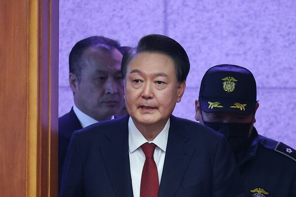 Impeached South Korean President Yoon Suk Yeol arrives for his impeachment trial at the Constitutional Court in Seoul, South Korea, Tuesday, Jan. 21, 2025. (Kim Hong-Ji/Pool Photo via AP)