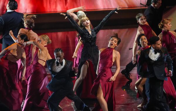 Lisa, center, sings "Live and Let Die" during the Oscars on Sunday, March 2, 2025, at the Dolby Theatre in Los Angeles. (AP Photo/Chris Pizzello)