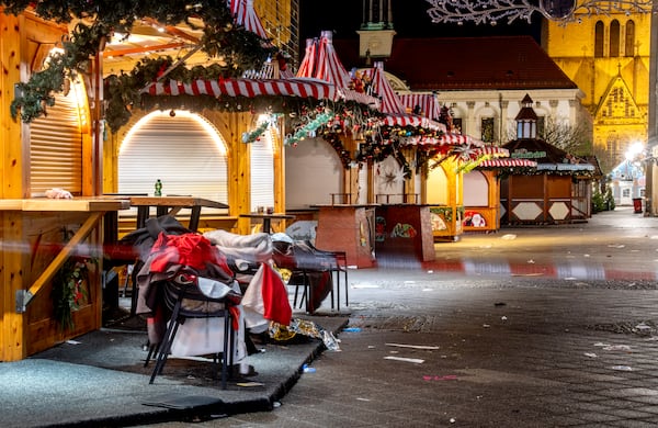 The Christmas market, where a car drove into a crowd on Friday evening, in Magdeburg, Germany, is empty on Sunday morning , Dec. 22, 2024. (AP Photo/Michael Probst)