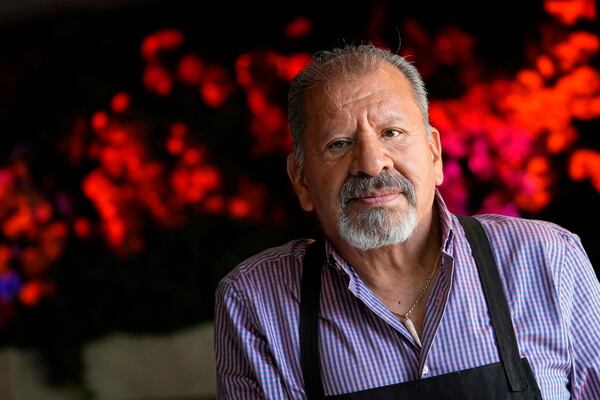 Michelin-starred Chef Mario Hernández Alonso of El Califa de León taqueria in Mexico City, stops for a photography while he prepares tacos at a Cinco de Mayo pop-up event at The Mexicano, Monday, May 5, 2025, in Phoenix. (AP Photo/Matt York)
