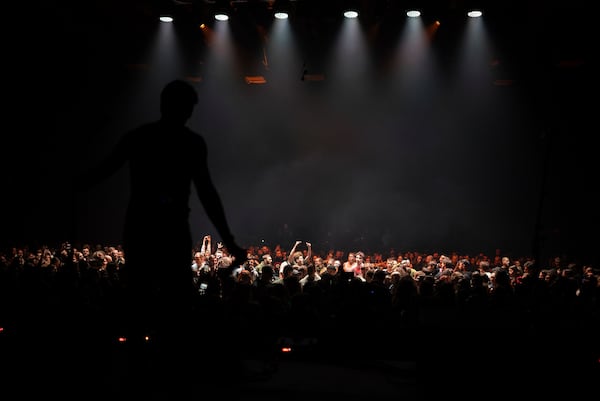 The Crowd react during the performance of punk rock band Hatespeech during the presentation of the music album Epoch, a collaboration between Ukrainian artists and the 3rd Assault Brigade, in Kyiv, Ukraine, Saturday, Dec. 7, 2024. (AP Photo/Alex Babenko)