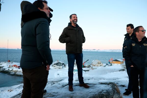 Donald Trump Jr., center, smiles after arriving in Nuuk, Greenland, Tuesday, Jan. 7, 2025. (Emil Stach/Ritzau Scanpix via AP)