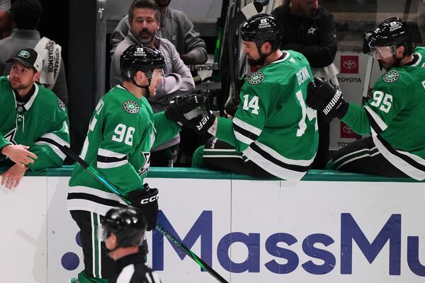 Dallas Stars' Mikko Rantanen (96) celebrates with Jamie Benn (14) and Matt Duchene (95) after scoring against the Colorado Avalanche in the third period in Game 7 of a first-round NHL hockey playoff series Saturday, May 3, 2025, in Dallas. (AP Photo/Julio Cortez)