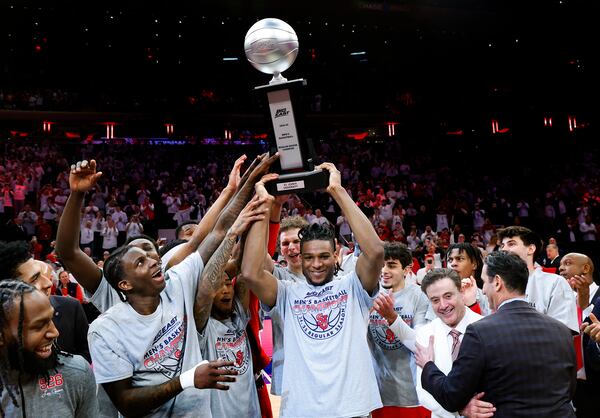 St. John's forward Zuby Ejiofor, center, celebrates with teammates after winning the Big East conference regular season title after they defeated Seton Hall in an NCAA college basketball game, Saturday, March 1, 2025, in New York. (AP Photo/Noah K. Murray)