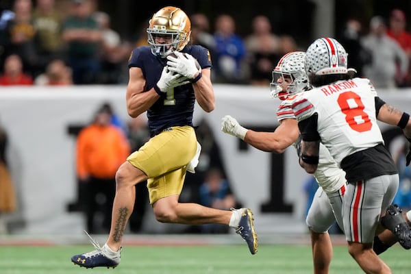 Notre Dame wide receiver Jaden Greathouse catches a pass against Ohio State during second half of the College Football Playoff national championship game Monday, Jan. 20, 2025, in Atlanta. (AP Photo/Brynn Anderson)