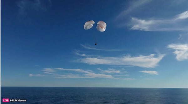 This image taken from video released by SpaceX shows a SpaceX capsule parachuting into the Gulf of Mexico, Tuesday, March 18, 2025. (SpaceX via AP)