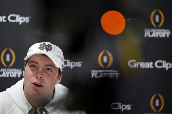 Notre Dame quarterback Riley Leonard talks during media day ahead of the national championship NCAA College Football Playoff game between Ohio State and Notre Dame Saturday, Jan. 18, 2025, in Atlanta. The game will be played on Monday. (AP Photo/Brynn Anderson)