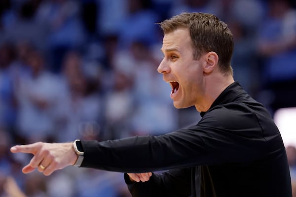 Duke head coach Jon Scheyer directs his team during the second half of an NCAA college basketball game against North Carolina, Saturday, March 8, 2025, in Chapel Hill, N.C. (AP Photo/Chris Seward)