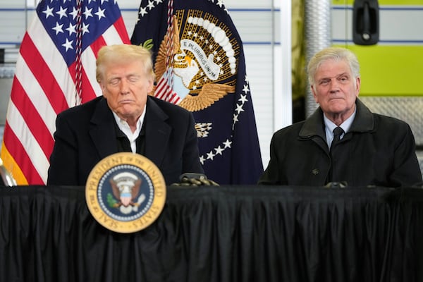 President Donald Trump is briefed on the effects of Hurricane Helene at Asheville Regional Airport in Fletcher, N.C., Friday, Jan. 24, 2025, as Franklin Graham looks on. (AP Photo/Mark Schiefelbein)