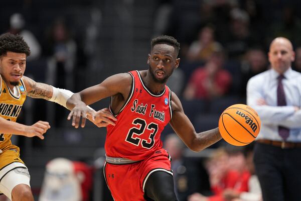 Saint Francis' Wisler Sanon II (23) dribbles against Alabama State's Micah Simpson during the first half of a First Four college basketball game in the NCAA Tournament, Tuesday, March 18, 2025, in Dayton, Ohio. (AP Photo/Jeff Dean)