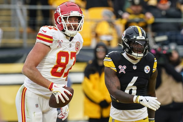 Kansas City Chiefs tight end Travis Kelce (87) celebrates his touchdown against the Pittsburgh Steelers during the second half of an NFL football game, Wednesday, Dec. 25, 2024, in Pittsburgh. (AP Photo/Matt Freed)