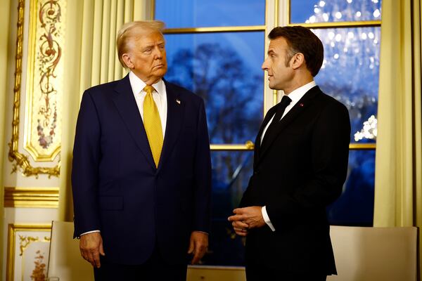 FILE - President-elect Donald Trump, left, attends a meeting with France's President Emmanuel Macron at the Elysee Palace in Paris, Dec. 7, 2024. (Sarah Meyssonnier/Pool via AP, File)