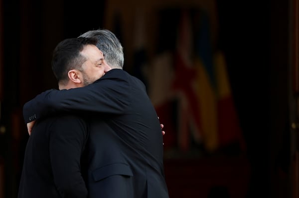 Britain's Prime Minister Keir Starmer, right, welcomes Ukrainian President Volodymyr Zelenskyy to the European leaders' summit to discuss Ukraine, at Lancaster House, London, Sunday March 2, 2025. (Toby Melville/Pool via AP)