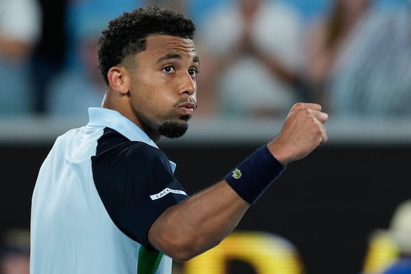 Arthur Fils of France reacts after winning his first round match against Otto Virtanen of Finland at the Australian Open tennis championship in Melbourne, Australia, Sunday, Jan. 12, 2025. (AP Photo/Asanka Brendon Ratnayake)