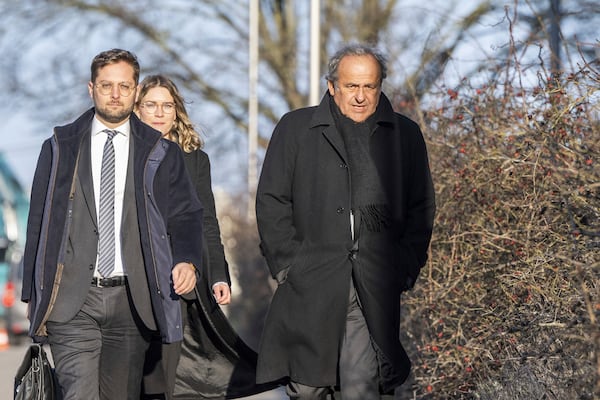 Michel Platini, right, former UEFA president and FIFA vice president, arrives for his retrial in front of the special appeals court, in Muttenz, Switzerland, Monday, March 3, 2025. (Urs Flueeler/Keystone via AP)