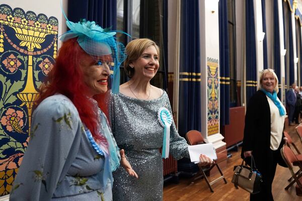Reform U.K.'s Greater Lincolnshire mayoral candidate Dame Andrea Jenkyns, center, gestures during the count at Grimsby Town Hall, in Lincolnshire, England, for the Greater Lincolnshire Mayor election, Friday, May 2, 2025. (Joe Giddens/PA via AP)