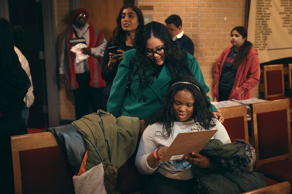 Students register to vote for school board elections during a Town Hall at the Bethany Baptist Church, Saturday, Feb. 1, 2025, in Newark, N.J. (AP Photo/Andres Kudacki)