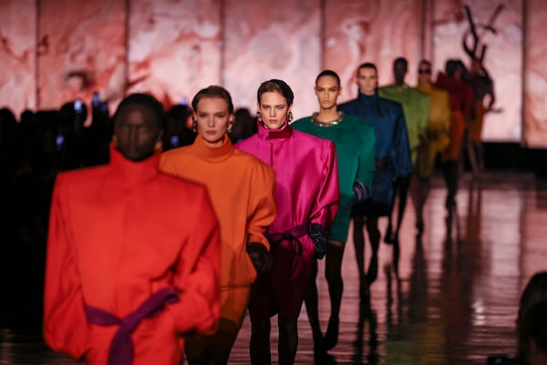 Models wear creations as part of the Saint Laurent Fall/Winter 2025-2026 Womenswear collection presented Tuesday, March 11, 2025. in Paris. (AP Photo/Thomas Padilla)