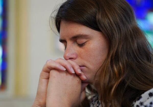 Zoey Stapleton prays during morning Mass at St. Joan of Arc Catholic Church in Hershey, Pa., Wednesday, July 3, 2024. (AP Photo/Jessie Wardarski)