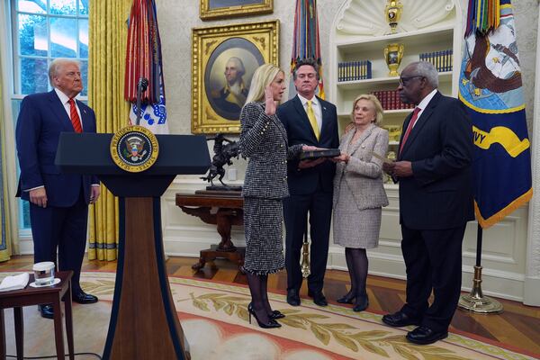 Pam Bondi is sworn in as Attorney General by Supreme Court Associate Justice Clarence Thomas, right, as President Donald Trump, John Wakefield and Patsy Bondi, look on, in the Oval Office of the White House, Wednesday, Feb. 5, 2025, in Washington. (AP Photo/Evan Vucci)