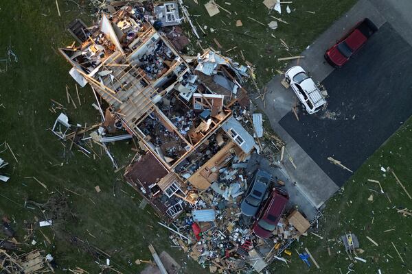 A home is destroyed after a severe storm passed through the area, Saturday, May 17, 2025, in London, Ky. (AP Photo/Carolyn Kaster)