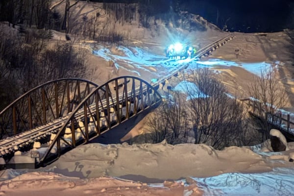 This image provided by the New Hampshire Fish and Game Department shows rescue hikers along the cog railway during a rescue mission, on Mount Washington, N.H., Sunday, Feb. 2, 2025. (New Hampshire Fish and Game Department photo via AP)