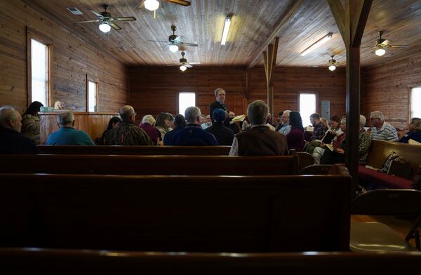 Matt Hinton, a shape-note singer, leads a song at a Sacred Harp singing event held at Holly Springs Primitive Baptist Church in Bremen, Ga., on Saturday, March 22, 2025. (AP Photo/Jessie Wardarski)