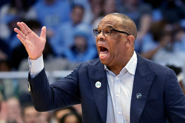 North Carolina head coach Hubert Davis directs his team during the first half of an NCAA college basketball game against North Carolina State, Wednesday, Feb. 19, 2025, in Chapel Hill, N.C. (AP Photo/Chris Seward)