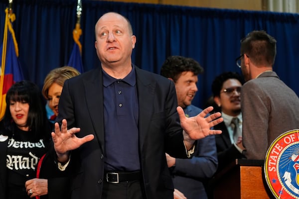 FILE - Colorado Gov. Jared Polis speaks after signing a for-cause eviction protections bill, April 19, 2024, at the state Capitol in Denver. (AP Photo/David Zalubowski, File)