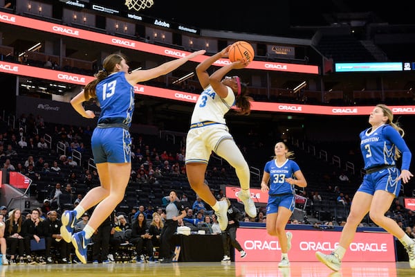 UCLA guard Londynn Jones (3) attempts a basket against Creighton guard Allison Heathcock (13) during the second half of an NCAA college basketball game Friday, Dec. 20, 2024, in San Francisco. (AP Photo/Eakin Howard)