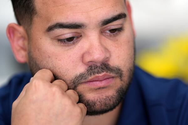 Wilmer Escaray reflects on the future of his employees and customers during an interview inside a franchise of "Sabor Venezolano," one of 18 businesses he owns which employ scores of Venezuelan immigrants with Temporary Protected Status (TPS) who are now potentially exposed to deportation, in Doral, Fla., Tuesday, May 20, 2025. (AP Photo/Rebecca Blackwell)