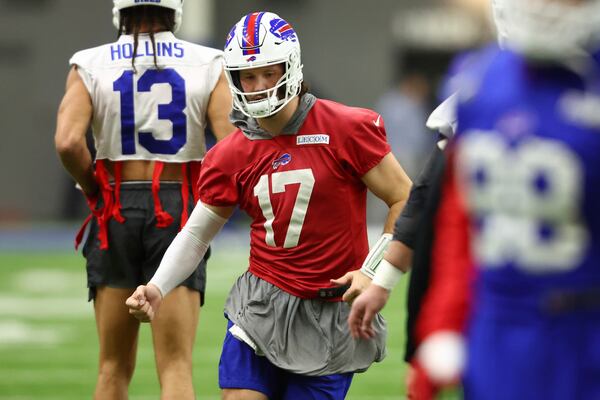 Buffalo Bills quarterback Josh Allen (17) warms up during NFL football practice in Orchard Park, N.Y., Thursday, Jan. 23, 2025. (AP Photo/Jeffrey T. Barnes)