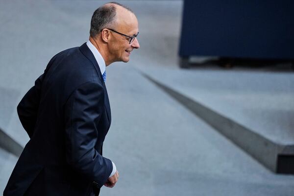 Friedrich Merz waits for the beginning of a session where he is expected to be elected new chancellor in the German federal parliament, Bundestag, at the Reichstag building in Berlin, Tuesday, May 6, 2025. (AP Photo/Ebrahim Noroozi)