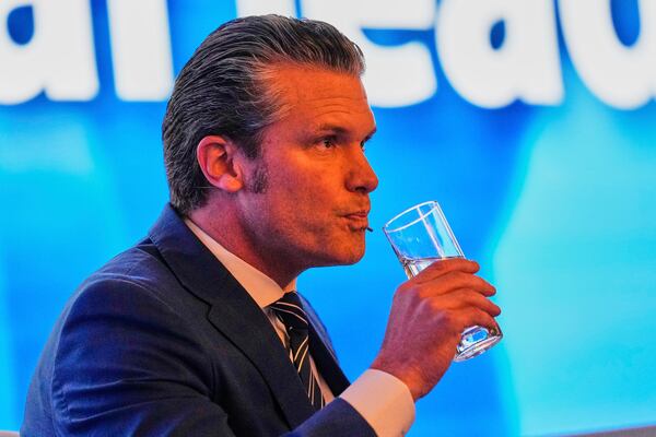 U.S. Defense Secretary Pete Hegseth drinks water during 22nd Shangri-La Dialogue summit in Singapore,Saturday, May 31, 2025. (AP Photo/Anupam Nath)