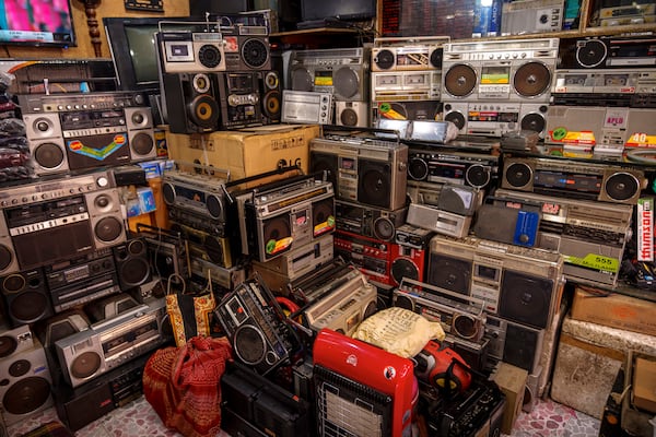 A stack of refurbished tape recorders for sale are seen in a shop in Srinagar, Indian controlled Kashmir, Friday, Feb. 14, 2025. (AP Photo/Dar Yasin)