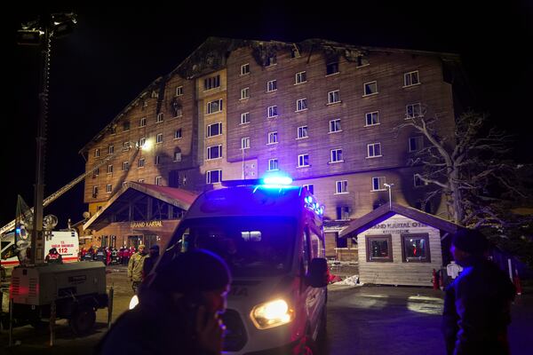 Firefighters and emergency teams work after a fire that broke out at a hotel in the ski resort of Kartalkaya, located in Bolu province, northwest Turkey, on Tuesday, Jan. 21, 2025. (AP Photo/Francisco Seco)