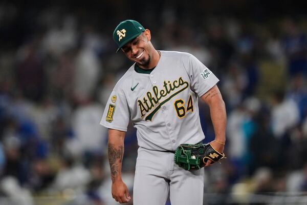 Athletics' Jhonny Pereda reacts after striking out Los Angeles Dodgers' Shohei Ohtani during the eighth inning of a baseball game Thursday, May 15, 2025, in Los Angeles. (AP Photo/Mark J. Terrill)
