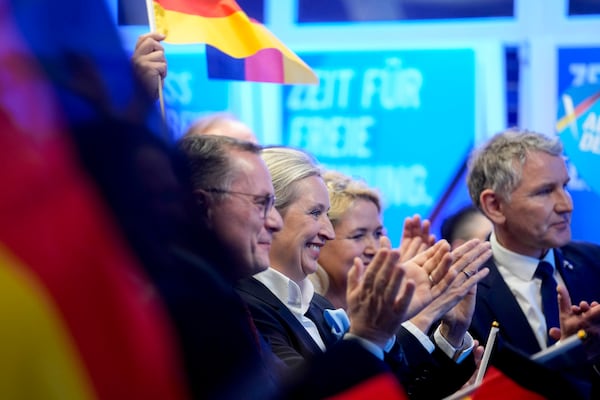 Leader of far right AfD Alice Weidel, centre, reacts at the AfD party headquarters in Berlin, Germany, Sunday, Feb. 23, 2025, after the German national election. (AP Photo/Michael Probst)