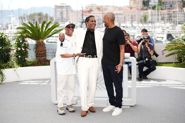 Director Spike Lee, from left, A$AP Rocky and Denzel Washington pose for photographers at the photo call for the film 'Highest 2 Lowest' at the 78th international film festival, Cannes, southern France, Monday, May 19, 2025. (Photo by Scott A Garfitt/Invision/AP)