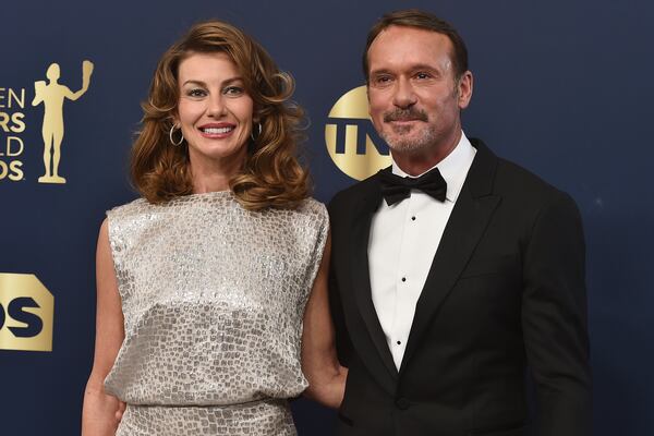 FILE0 Faith Hill, left, and Tim McGraw arrive at the 28th annual Screen Actors Guild Awards at the Barker Hangar on Sunday, Feb. 27, 2022, in Santa Monica, Calif. (Photo by Jordan Strauss/Invision/AP, File)