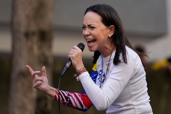 Opposition leader Maria Corina Machado addresses supporters during a protest against President Nicolas Maduro the day before his inauguration for a third term in Caracas, Venezuela, Thursday, Jan. 9, 2025. (AP Photo/Matias Delacroix)