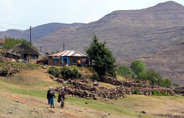 FILE - Elderly women leave the poling station after casting their vote in Thaba-Tseka District, 82km east of Maseru, Lesotho, Friday, Oct. 7, 2022. (AP Photo/Themba Hadebe, file)