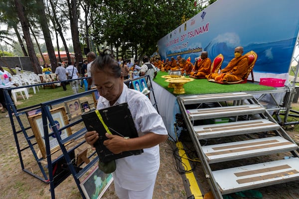 A relative of a victim of a 2004 Indian Ocean tsunami participates in its 20th anniversary at Tsunami Memorial Park at Ban Nam Khem, Takuapa district of Phang Nga province, southern Thailand, Thursday, Dec. 26, 2024. (AP Photo/Wason Wanichakorn)