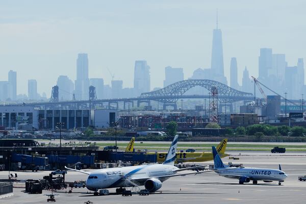 The New York City skyline is seen behind Newark Liberty International Airport in Newark, N.J., Wednesday, May 7, 2025. (AP Photo/Seth Wenig)