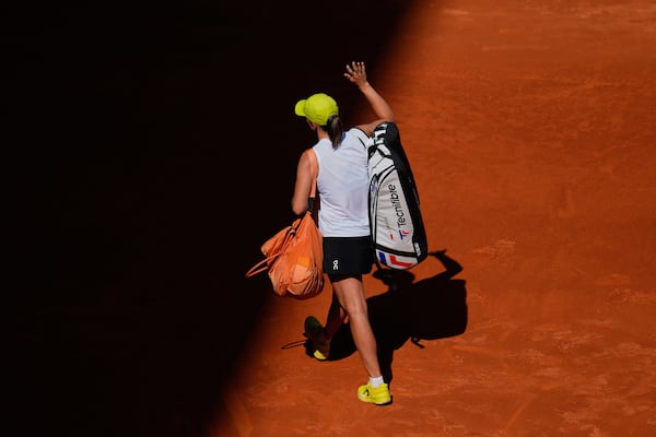 Iga Swiatek of Poland leaves the court after losing against United States' Coco Gauff during the Madrid Open tennis tournament in Madrid, Spain, Thursday, May 1, 2025. (AP Photo/Manu Fernandez)