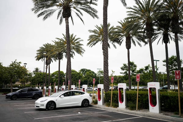 FILE - Tesla electric vehicles are charged at a station in Anaheim, Calif., Friday, June 9, 2023. (AP Photo/Jae C. Hong, File)